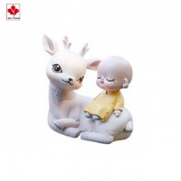 Child sitting on deer shaking his head doll car decoration creative desktop decoration resin furnishings